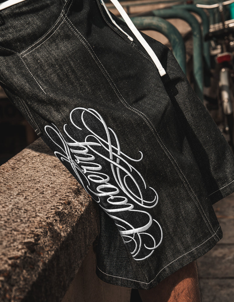 CALIGRAPHY RAW DENIM JORTS