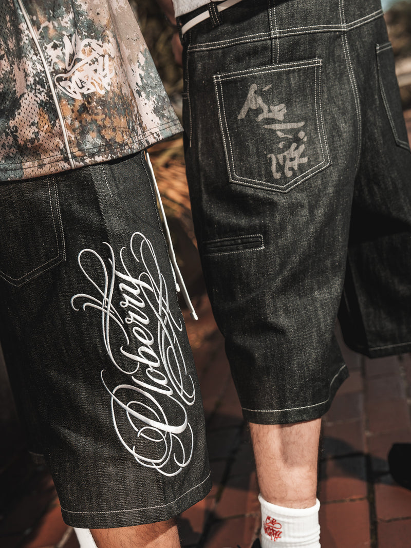 CALIGRAPHY RAW DENIM JORTS
